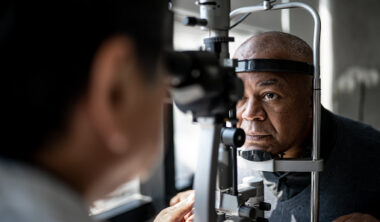 Ophthalmologist examining patient's eyes